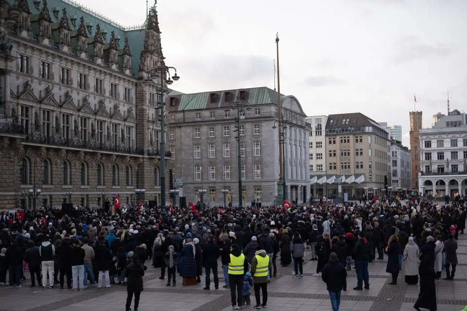 Wide view of a large gathering filling the Rathausmarkt in Hamburg